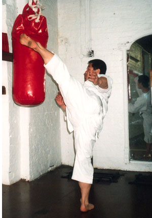 Sensei Masao Kagawa demonstrates 'bag training' at Dennis Tilley's Manchester UK. dojo (1992).